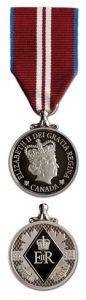 The Diamond Jubilee Medal, which has a dark red ribbon and an engraving of the queen.