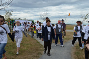A group of Stroll participants walk the route