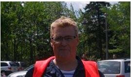 Gary Trainer headshot with forest in the background
