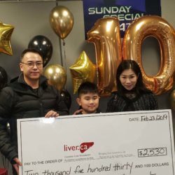 Little heroes: family with large cheque for CLF