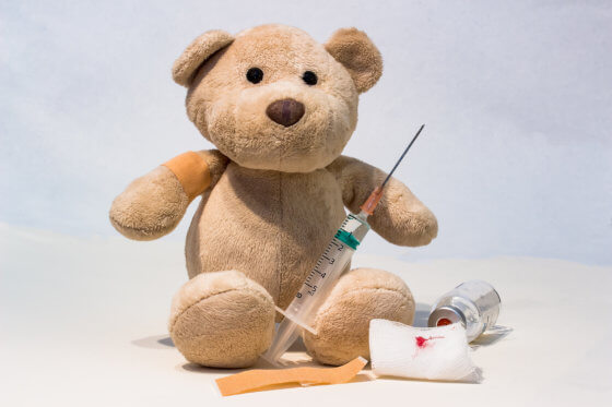 Teddy bear and a needle