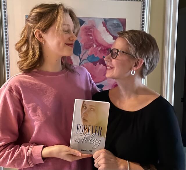 Image of Janet-Lynn and her daughter with the novel