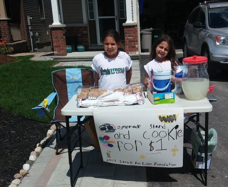 Lillian and her sister fundraising for the Stroll