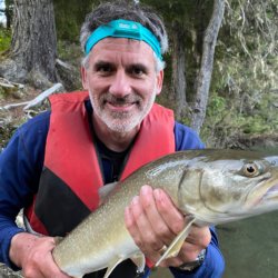 photo of Dr. Daniel Holmes holding a fish